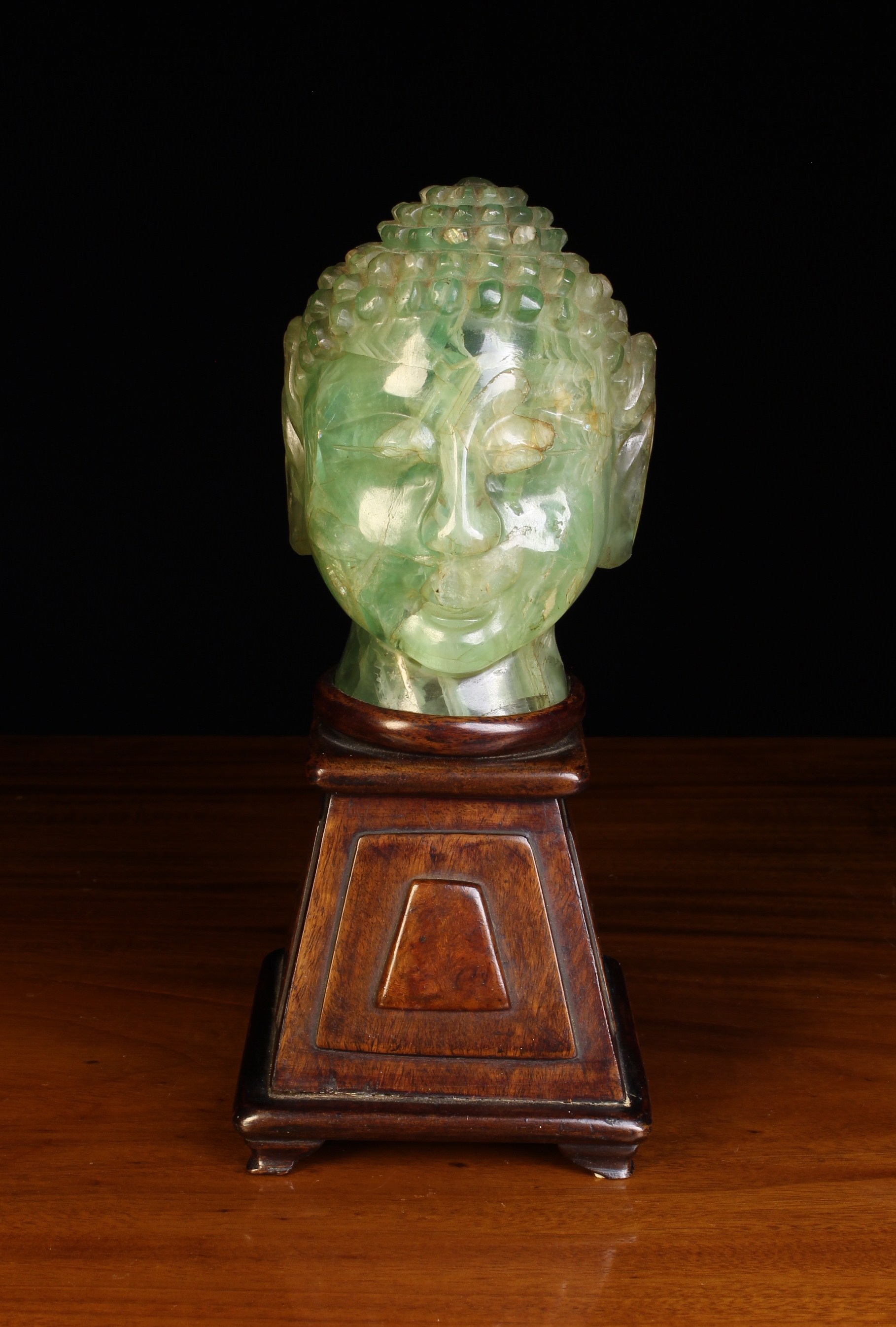 An Unusual Carved Green Onyx Table Lamp with mahogany stand.