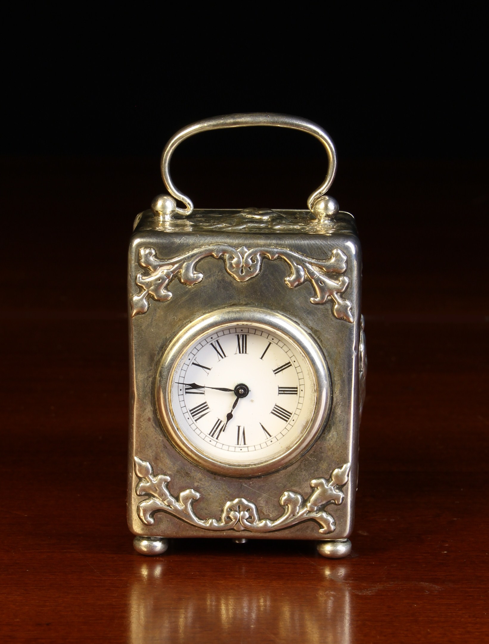 A Miniature Silver Cased Clock by William Comyns hallmarked London 1903.
