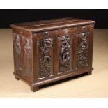 A 19th Century Joined Oak Coffer enriched with carving.