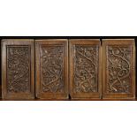 A Set of Four 16th Century Oak Panels: Each carved with an undulating stem of vine with scrolling