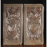A Pair of Large 16th Century English Oak Panels boldly carved with depictions of Saint Barbara