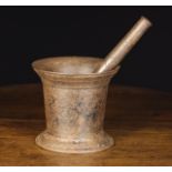 A 20th Century 'Cannon' No 7 Pestle & Mortar cast with foundry name to the pestle and foot moulding,