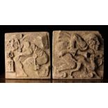 A Pair of Ornamental Composite Stone Slabs carved in a relief with a night warden crouched over