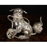 An Antique Japanese Cast Bronze Dog-of-Fo, 5½" (14 cm) high, 6½" (16.5 cm) in length.