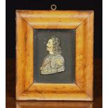 A 19th Century Painted Relief-Cast Bust of Charles I set behind glass in a moulded birds-eye maple