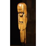 A Late 17th/Early 18th Century Folk Art Treen Nut Cracker naively carved in the form of a head with
