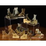 A Collection of Ornamental Brass Shoes silhouette cut from sheet brass and embellished with nail