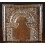 A 17th Century Carved Oak Arcaded Panel enriched with punchwork and forming the sliding lid of a