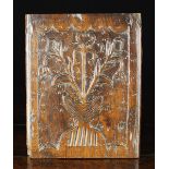 A Delightful 18th Century Fruitwood Folk Art Panel carved with a stylised urn of flowers and