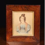 A Charming 19th Century Half length Portrait of a Young Lady, her hair in a top knot and ringlets,