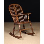 A 19th Century Windsor Rocking Chair with pierced centre splat.