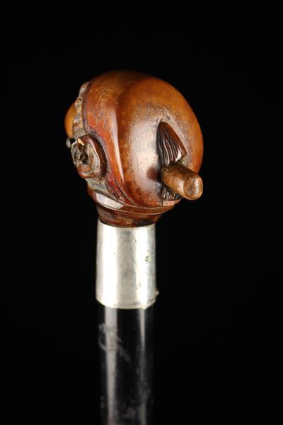 An Edwardian Silver-banded Ebonised Walking Stick with articulated Monkey's head handle. - Image 4 of 7