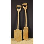 Two Vintage Treen Shovels, both branded 'C of W' to the integral handles,