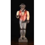 A Carved & Polychromed Wooden Advertising Figure of a Black Man holding out his hand,