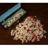 A Quantity of Fretted & Stained Bone Letters; white, green and red alphabets,