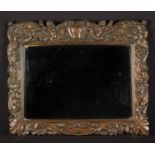 A 17th Century Carved Oak Frame with later rectangular mirror plate.