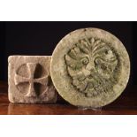 A Carved Stone Roundel emblazoned with a Green Man face mask 14" (36 cm) in diameter,