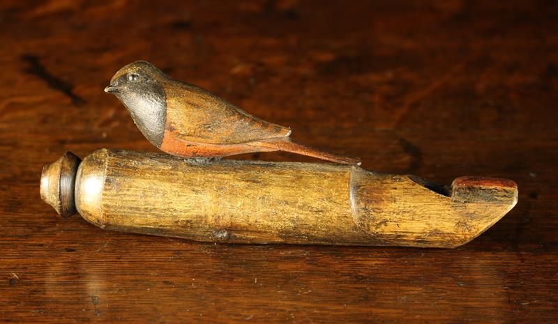 A Vintage Treen Folk Art Cuckoo Whistle surmounted by a carved cuckoo with painted plumage,