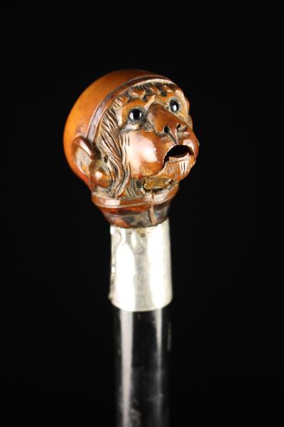 An Edwardian Silver-banded Ebonised Walking Stick with articulated Monkey's head handle. - Image 2 of 7