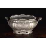 A French Pewter Oval Tureen with Rococo decoration and lig handles either side, 6¼" (16 cm) high,