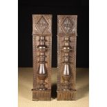 A Pair of 17th Century Carved Mantel Piece Uprights; the facades adorned with bold turned appliqués,