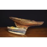 An Antique Dug-out Wooden Pond Boat with pin nailed mahogany gunwhale strips,