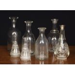 Seven Antique Glass Carafes: A graduated near set of three 11½" (29 cm), 10¾" (27 cm) and 9¼" (23.