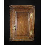 An 18th Century Oak Hanging Corner Cupboard.