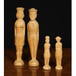 Four Folk Art Peg Figures: Two couples carved from pine with nail punched details.