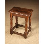 A 17th Century English Oak & Walnut Joint Stool of good colour and patination.