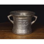 A Large 17th Century Cast Iron Mortar dated 1669 and initialed WG between raised ring moulding,