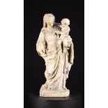 A 17th Century Limestone Carving of The Virgin & Child.