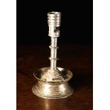 A 16th Century Style Brass Candlestick with silver plate coating.