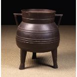 A Large 17th Century Cast Iron Cauldron.