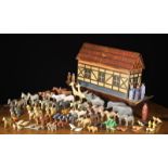 A Vintage Painted Wooden Toy Model of Noah's Ark with a multitude of naively carved and painted