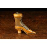 A 19th Century Carved Fruitwood Snuff Box in the form of a lady's boot laced with copper wire and