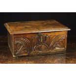 A 17th Century Boarded Oak Bible Box. The plank lid with moulded edge on replacement hinges.