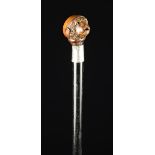 An Edwardian Silver-banded Ebonised Walking Stick with articulated Monkey's head handle.