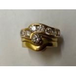 An interesting 18ct yellow gold trio combination of diamond rings, to include engagement, wedding