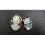 An 18ct gold cameo 4cm long approx weight 8.7 grams and a 9ct gold Paua shell cameo 35mm x 28mm