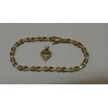 A hallmarked 9ct gold bracelet 19cm long and a 9ct hallmarked yellow gold heart pendant, total