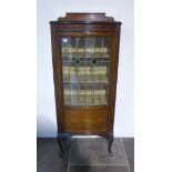 A 1920's decorated mahogany bowfronted display cabinet with leaded glazed door, 145cm tall x 59cm