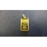 A 5g ingot of 999.9 fine gold in a 21K pendant mount, total weight approx 7 grams, in good condition