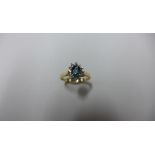A 10ct yellow gold blue topaz and diamond ring, marked 10K, size L, approx 1.7 grams, in good