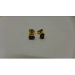 A pair of 18ct yellow gold sapphire stud earrings, sapphires approx 4mm x 6mm, both generally