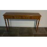 A burr wood four drawer hall/side table on turned reeded legs made by a local craftsman to a high