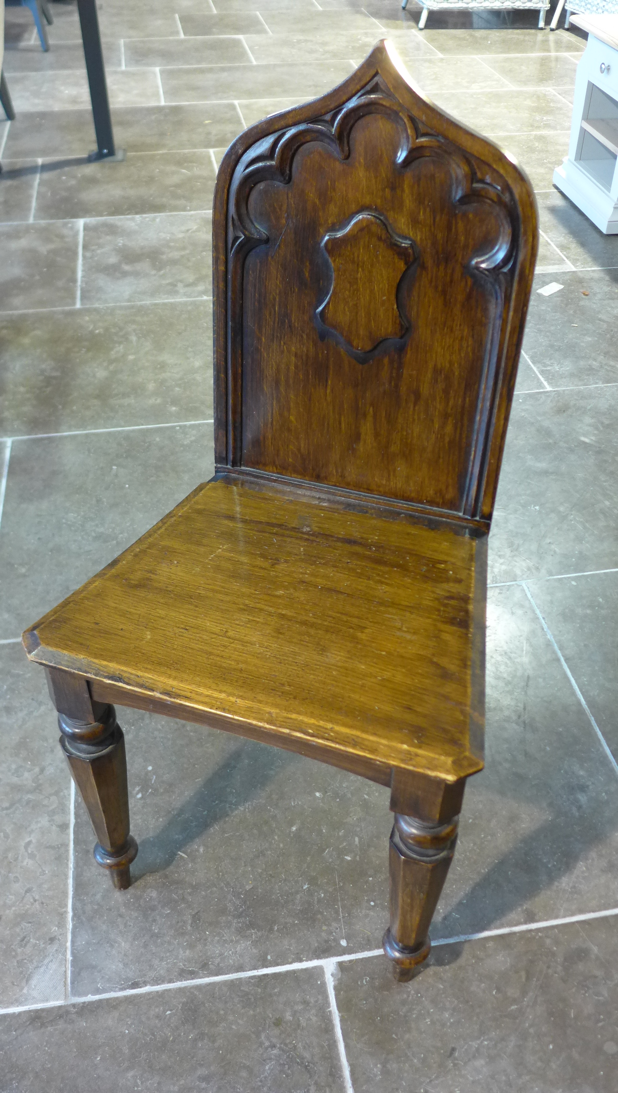 A Victorian oak gothic style hall chair