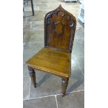 A Victorian oak gothic style hall chair