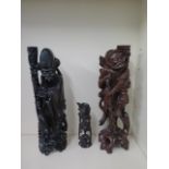Two Oriental carved rootwood figures, one with white metal inlay, 60cm and 59cm tall, both with good