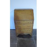 A light oak 1930's three drawer bureau, 100cm tall x 63cm x 40cm